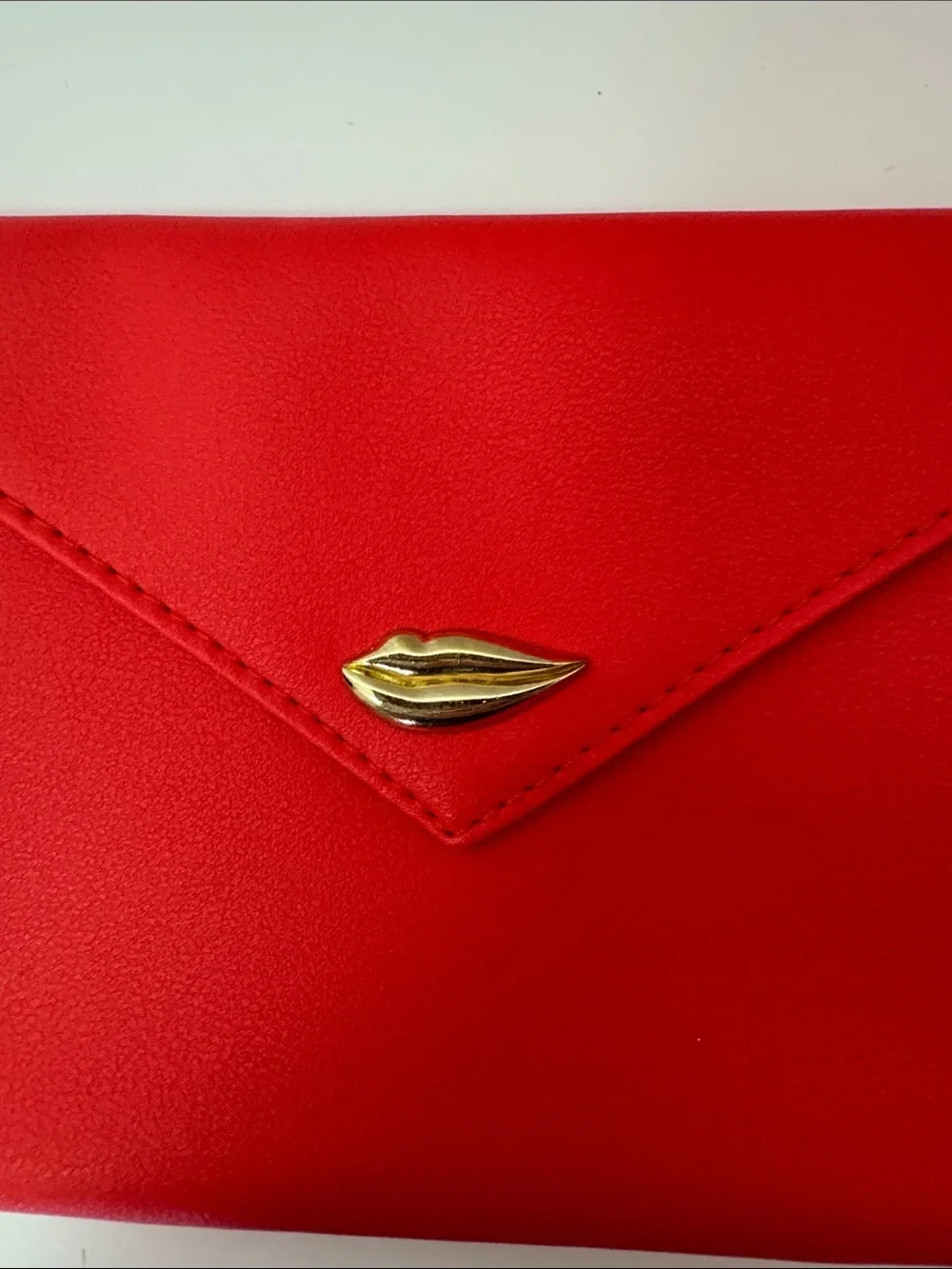 This is a red Ipsy Sealed with a Kiss makeup bag NWOT